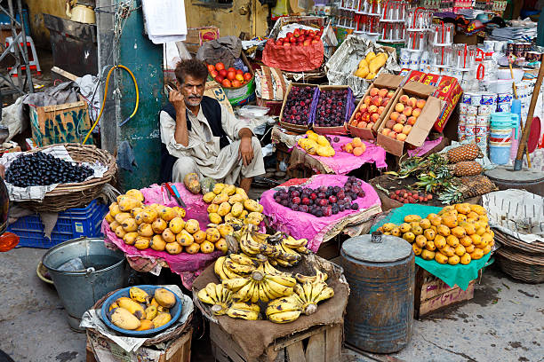 Pakistani man sells fresh fruits at Raja Bazaar in Rawalpindi. 