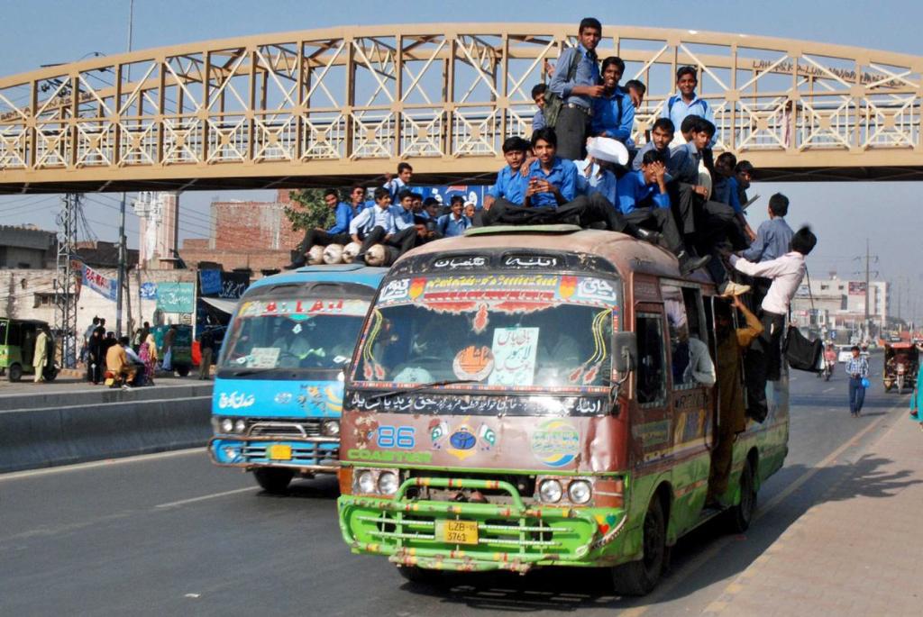 Transportation means in Rawalpindi. Students are hanging over a bus to reach schools and colleges in Rawalpindi