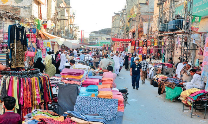A Typical market of Saddar Bazar Rawalpindi and people are busy in Shopping. 
